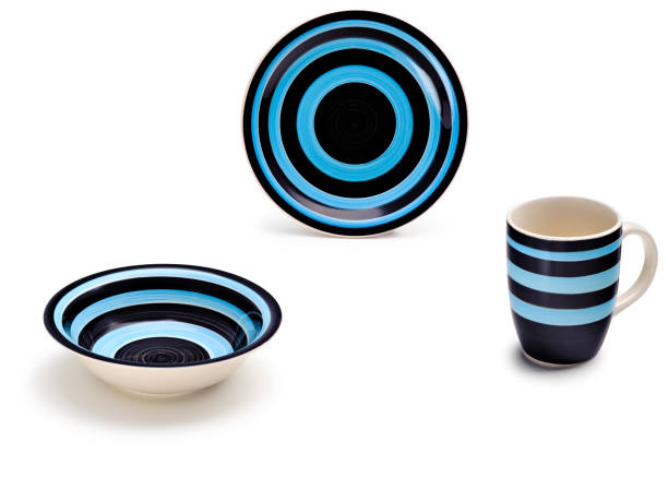 istock Fun blue ceramic kit with two plates and a mug, isolated on white 1413127661
