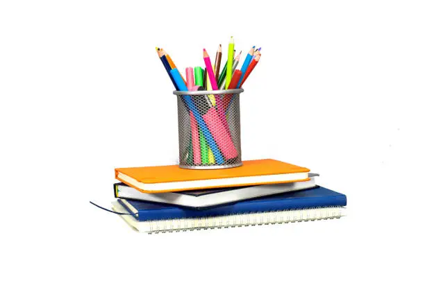 Back to school concept - blackboard with pencil-box and books, notebook isolated on white