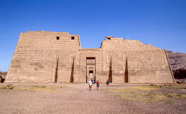 Temple of Ramesses III known as Medinet Habu Luxor, Egypt - aug 10, 1991: on the left bank of the Nile, on the road to the Valley of the Kings, is the Mortuary Temple of Ramesses III, dedicated to the god Amon. medinet habu stock pictures, royalty-free photos & images