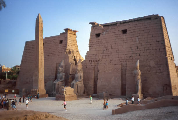 Luxor, Egypt - aug 10, 1991: view of the first entrance pylon to the Temple, with statues of the pharaoh RamsesII and the remaining obelisk, the second was brought to Paris
