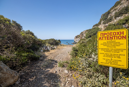 No Entry Sign at Preveli Beach on Crete, Greece. The reason is fire risk in the palm grove.