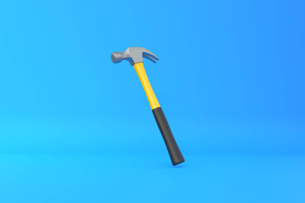 istock Claw hammer with yellow plastic handle isolated on yellow background 1413138244