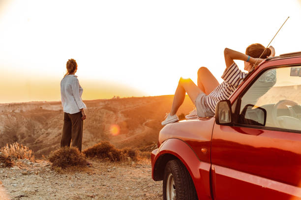 istock Two girl enjoying on a road trip 1413138748