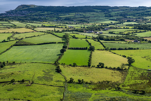 View from the vantage of the southern escarpment of the Antrim plateau towards the coastal community of Ballygally and the headland at Cairndhu, Northern Ireland.