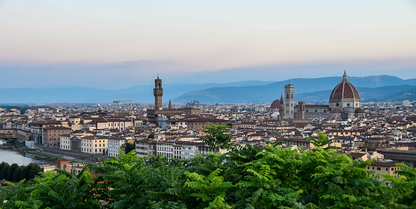 Florence, Italy - jul 17, 2022: at the first light of dawn, classic panoramic view of Florence from the belvedere of Piazzale Michelangiolo.