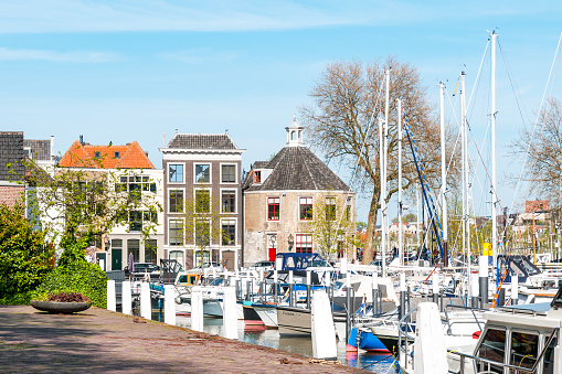 Vlissingen, The Netherlands - June 28, 2019: Historic inner harbor medieval Dutch city Vlissingen with yachts and restaurants