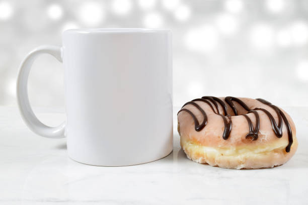 istock 11 oz White Mug Mockup with Donut 1413143969