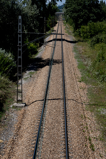 A single train track in a straight line going into the distance.