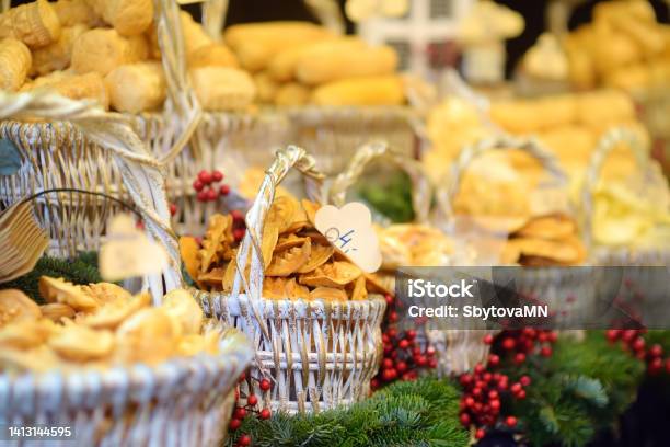 Traditional Poland Street Food Oscypek Is A Grilled Cheese Of Salted Sheep Milk With Different Ingredients As Bacon Or Jams Basket Of Oscypek On Christmas Market In Krakow Stock Photo - Download Image Now