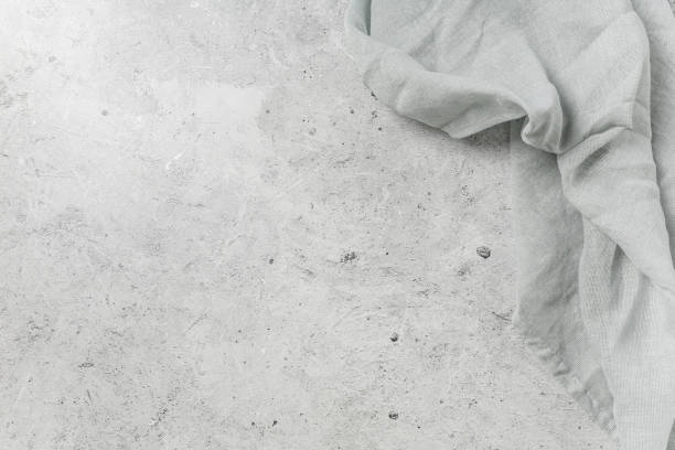 istock Grey marble background with grey textile cloth or napkin. 1413145844