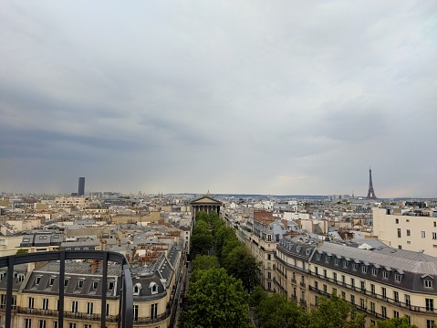 Montparnasse Tower, Madeleine Church and Eiffel Tower in stormy weather in Paris in summer