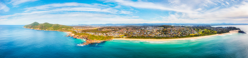 Wide aerial panorama facing One Mile beach in Forster town of Australia from Pacific ocean.