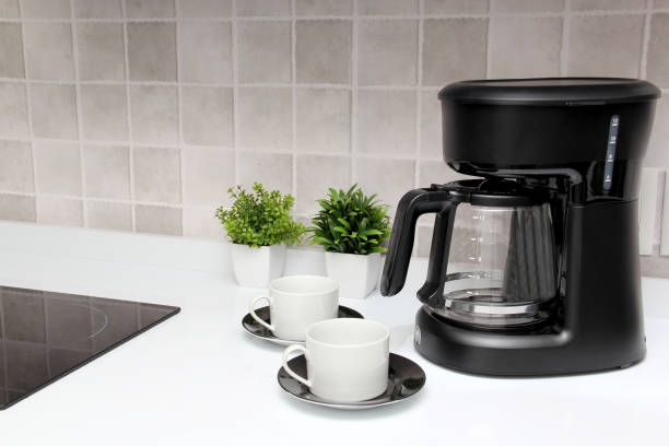 istock Freshly prepared coffee in a filter coffee machine served in white cups that is rich in antioxidants, fights Alzheimer's and Parkinson's, produces tachycardia and insomnia 1413148905