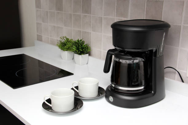 istock Freshly prepared coffee in a filter coffee machine served in white cups that is rich in antioxidants, fights Alzheimer's and Parkinson's, produces tachycardia and insomnia 1413148972