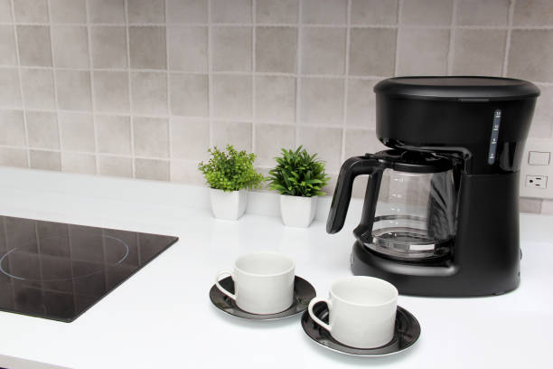 istock Freshly prepared coffee in a filter coffee machine served in white cups that is rich in antioxidants, fights Alzheimer's and Parkinson's, produces tachycardia and insomnia 1413148981