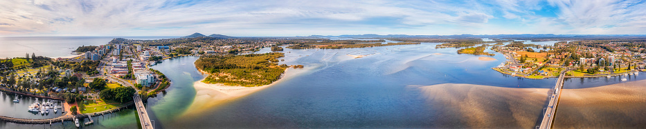 Wide Wallis lake Coolongolook river between Forster and Tuncurry towns on AUstralian pacific coast - aerial panorama.
