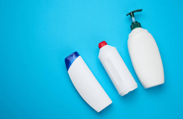 istock White plastic bottles with a pump for shampoo, shower gel on a blue background 1413152234
