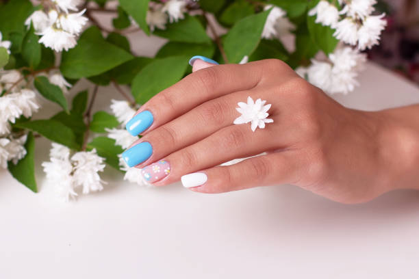 istock Female hands with summer manicure nails 1413154029