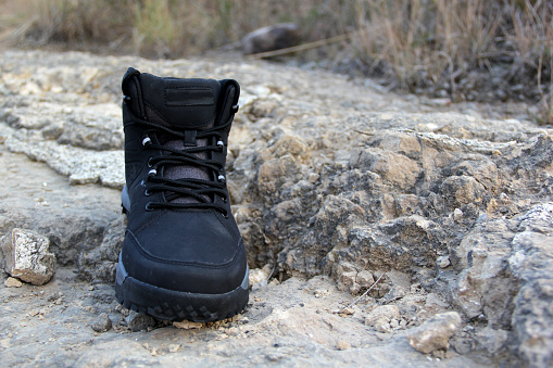 Hiking boots in the middle of the field walk, pose, play, explore, discover