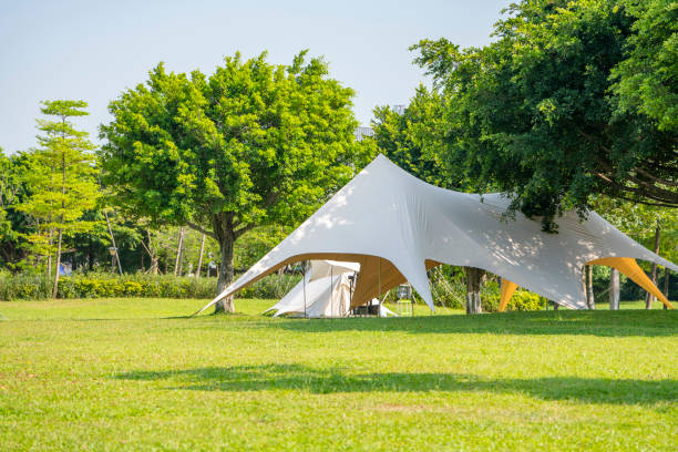 istock Camping tents on the park grass 1413155925
