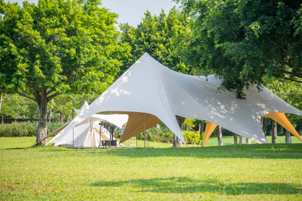 istock Camping tents on the park grass 1413155943