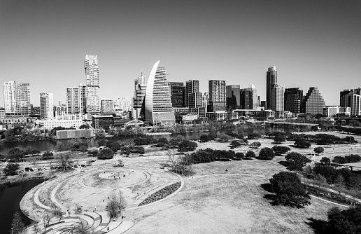 Aerial Drone views of the Austin Texas Cityscape over Public Park in black and white