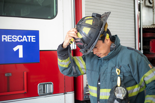 Lethbridge, Alberta, Canada  - September 21, 2011: A fireman talks to a young boy at the Open House and Demonstration Day, where City Residents were invited to Celebrate the newly remodelled Fire and Training Station - #4 Station at 20th St. and 5th Ave. North.  A variety of demonstrations were held during the afternoon.  The firemen were willing to visit and answer any questions the public had.