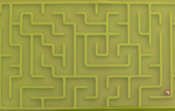 istock View of green labyrinth game with silver ball 1413162926