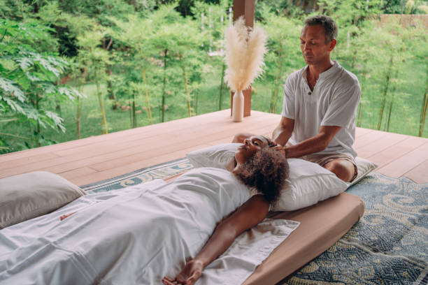 istock Woman having reiki healing treatment 1413163054