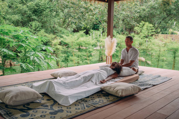 istock Woman having reiki healing treatment 1413163061