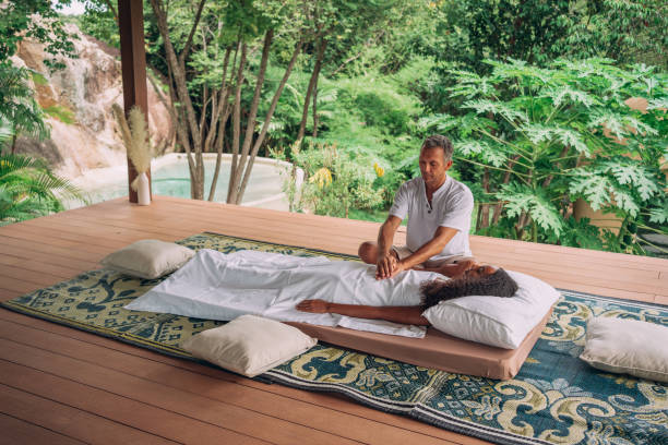 istock Woman having reiki healing treatment 1413163104
