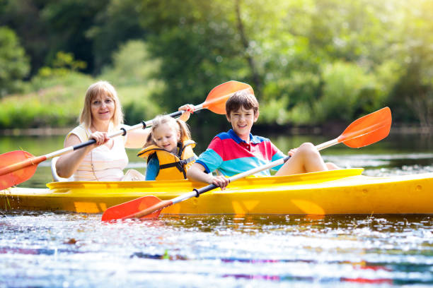 istock Child on kayak. Kids on canoe. Summer camping. 1413163242