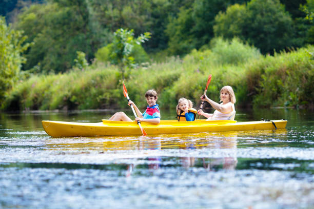 istock Child on kayak. Kids on canoe. Summer camping. 1413163875