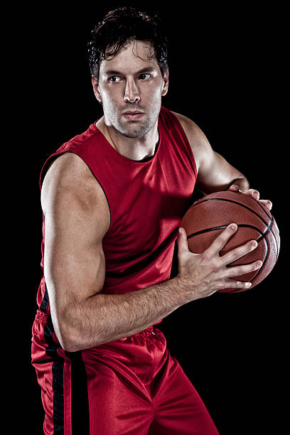 istock Basketball player holding a basketball 141316408
