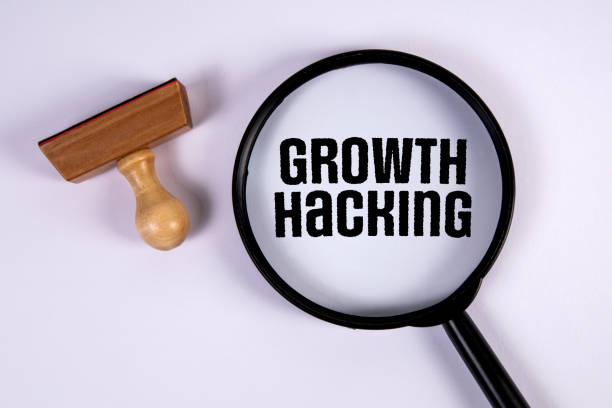 istock Growth hacking. Stamp and magnifying glass on white background 1413166165