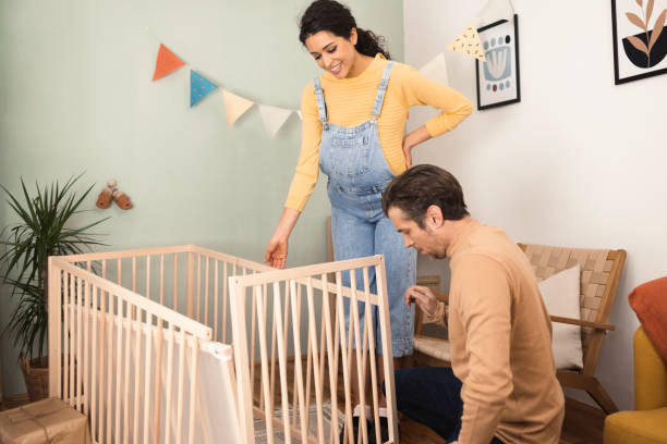 istock Happy future parents preparing for a baby 1413169823