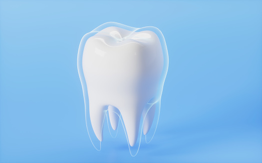 Glowing protective cover out of the tooth in the blue background, 3d rendering. Computer digital drawing.