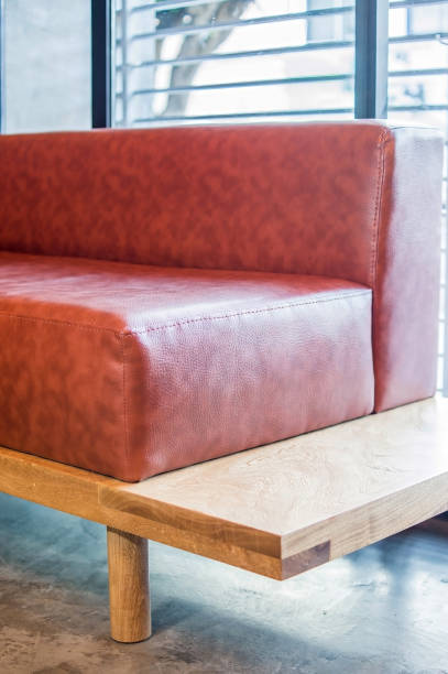 istock L-shaped armchair or sofa in solid oak or oak wood, with natural leather seat, 1413179717