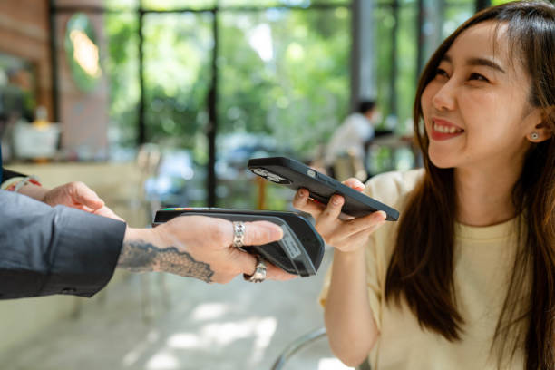 istock Asian Senior Business owner is serving customers. 1413185991