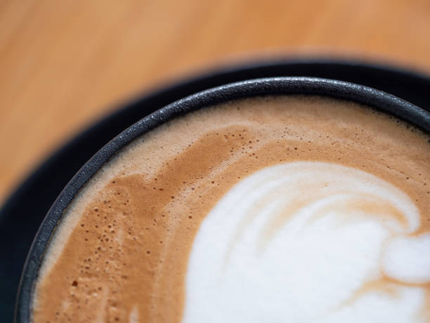 Flat White Coffee against wooden background