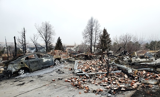 Superior, Colorado, USA- January 21, 2022: houses and a car totally destroyed in a December 30, 2021 wildfire.
