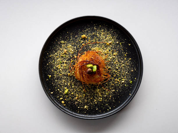 istock Cooked Turkish dessert Kataifi served on a plate 1413192032