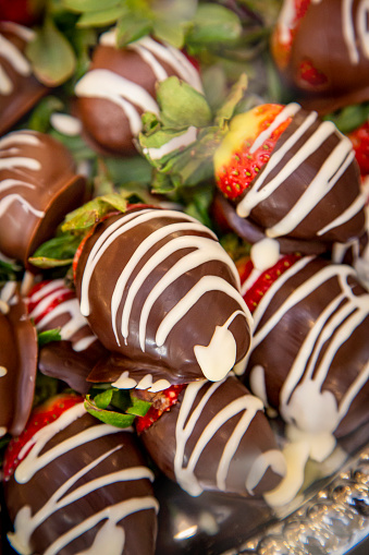 Close up of strawberries covered in dark and white chocolate