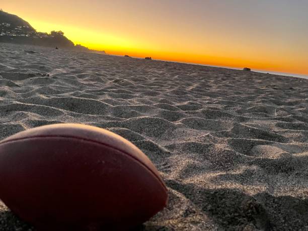 istock Sunset beach football 1413197261