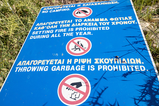 Warning Sign on Dionyssos Beach at Rethymno Province in Crete, Greece