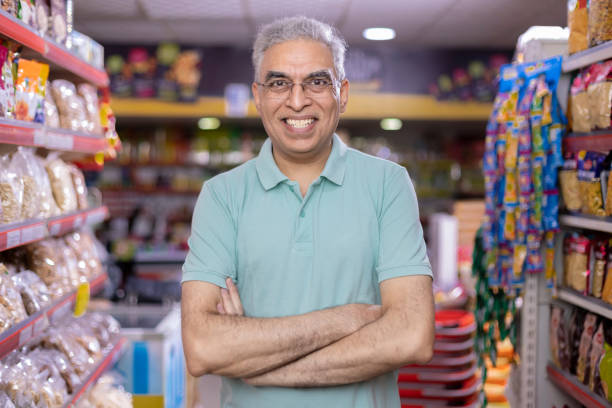 istock Senior man at supermarket store 1413201536
