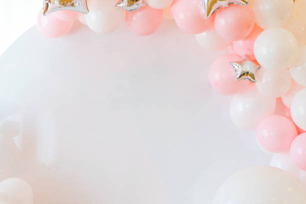 frame on a white background of pink and white balloons stock photo
