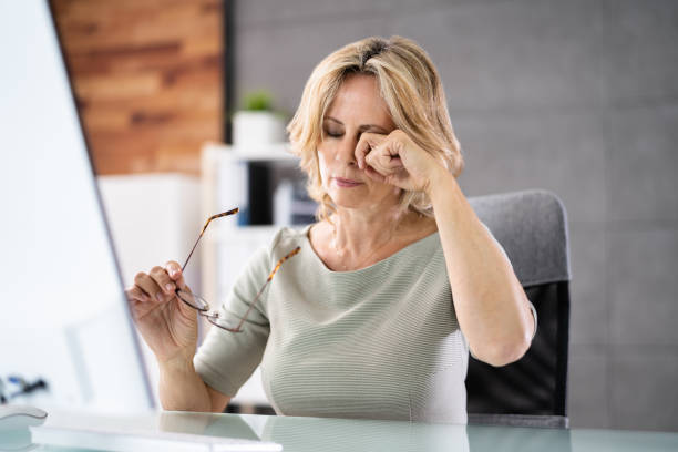 Woman Eye Fatigue And Pain. Tired Working stock photo