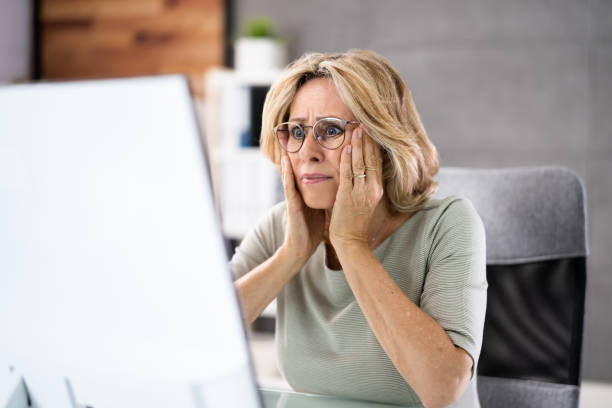 istock Frustrated Businesswoman Looking At Her Computer Screen 1413203948