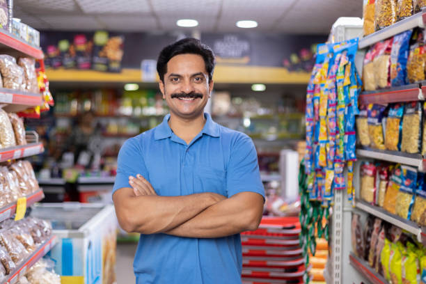 happy man at supermarket store - asian ethnicity shopping mall supermarket store imagens e fotografias de stock